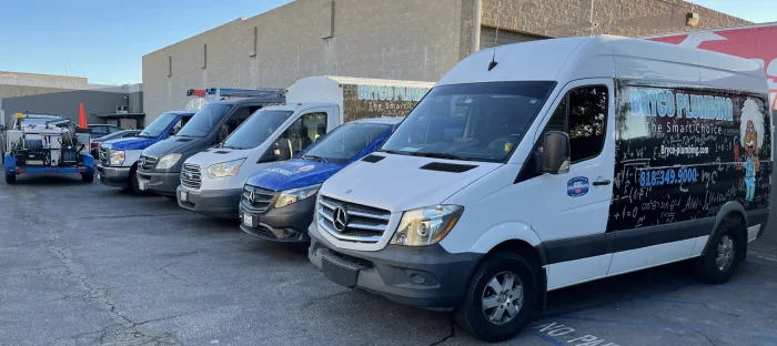 the bryco plumbing fleet lined up in front of the shop ready to assist with all your plumbing needs!